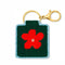 completed green needlepoint keychain kit with baby blue trim, orange flower print and gold hardware
