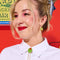 model wearing olive dangle earrings on gold hoops