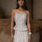 model wearing light pink tank with side corset ties and vintage dainty floral wallpaper print