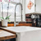 pink swedish dishcloths with abstract papaya print hanging in kitchen