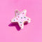 pink sugar cookie star hair claw on a pink background