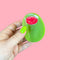 model holding oversized green olive hair claw