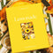 packaged 1000 piece puzzle with lemon inspired pastries and desserts on a striped tablecloth