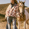 model wearing white sherpa half zip with denim trim and collar and red floral print