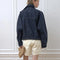 back view of model wearing oversized high neck denim cropped jacket