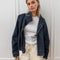 model wearing oversized high neck denim cropped jacket