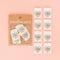 set of 8 cream cotton sewing labels that say 'thanks i made it' inside a heart