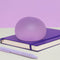 mist purple jumbo memory gel stress ball on a desk