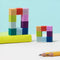 set of mini colorful magnet balls that you can mold into different shapes in a rectangular shape on a desk