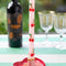 set of 2 pink dinner candles with all over cherry print on a table