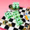 green mini bread clip mini hair claw on a table