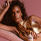 model posing with classic whip SPF 30 glow: broad spectrum SPF 30 shimmer sunscreen mousse