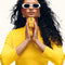 model holding vacation by vacation sunscreen body mist