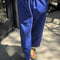 model wearing royal blue carpenter cotton pants