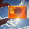 model holding sun tea scented bar soap to the sun