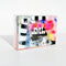 packaged clear bar soap with colorful striped pieces inside