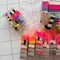 clear bar soap with colorful striped pieces inside