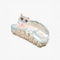 white Persian cat hair claw with pink bow on their neck