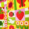 up close of garden flower, veggie and critter themed quilt kit