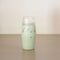 clear glass with a light green beverage inside