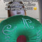 model showcasing green velvet travel pillow with white 'what a dream' with pink bow