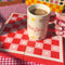 model filling cherry on top mug with a delicious beverage