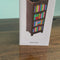 model unboxing brown bookshelf vase with colorful book shelves