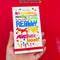 hands flipping through sticker book, featured in front of a red background