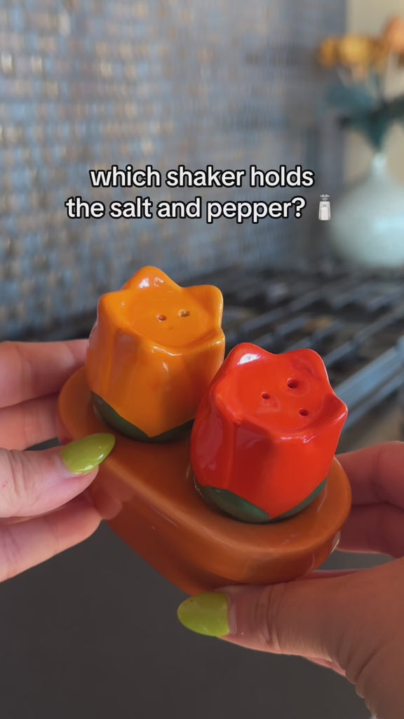model showcasing orange and red tulip salt and pepper shakers