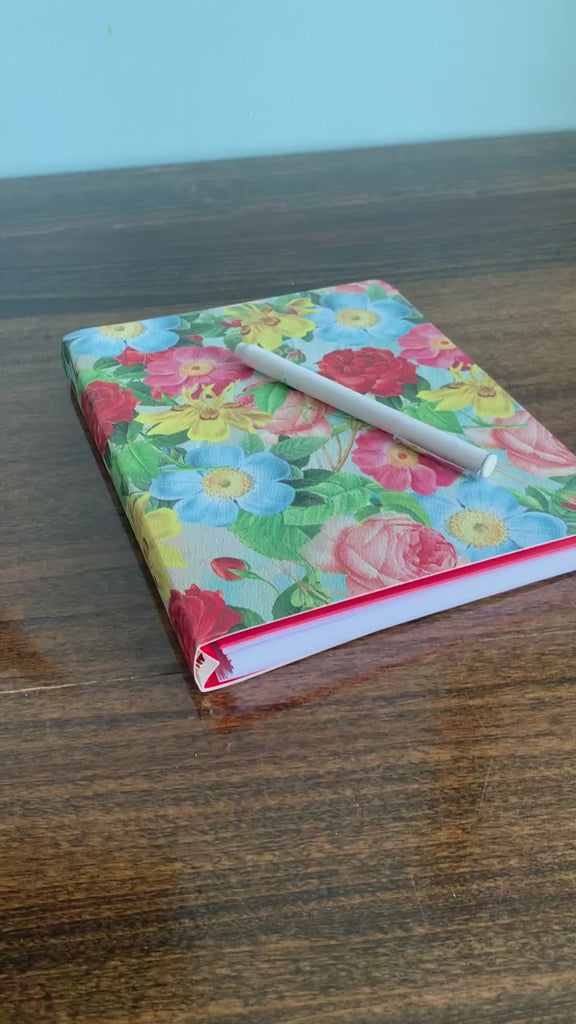 model flipping through colorful oil painting floral to do planner
