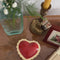 model opening red heart shaped trinket box with jewelry inside