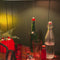 model making a mocktail with barware 