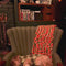 model putting house shaped and strawberry candy throw pillows behind a sleeping dog