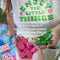 model playing pink and green four in a row board game