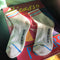 pair of white socks with red and blue stripe accents