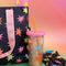 sip sip glitterbomb tumbler with colorful starburst print, pink lid, and red silicone straw
