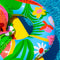 Tutti Frutti pool float sitting beside the pool